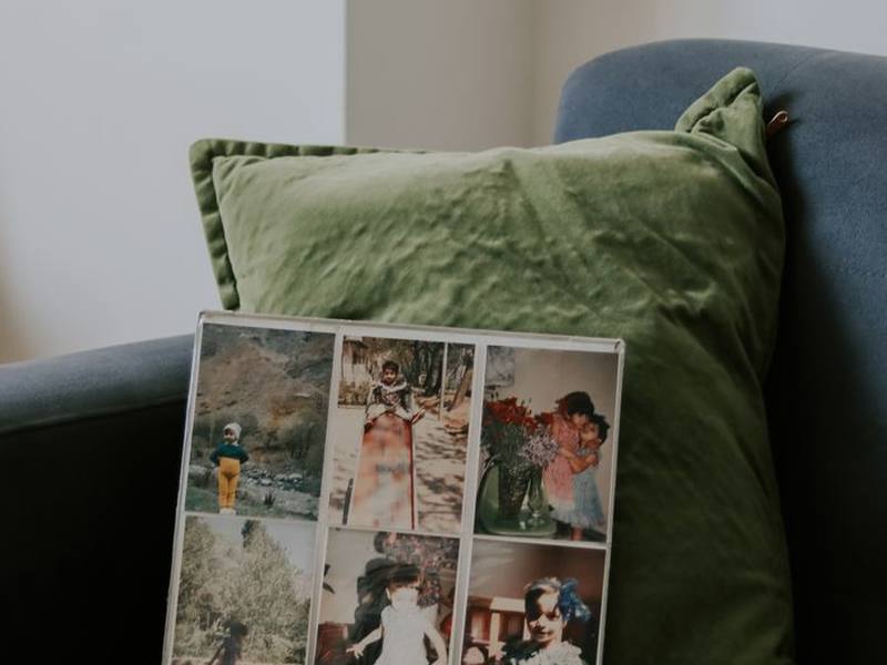 A photo album resting on an armchair